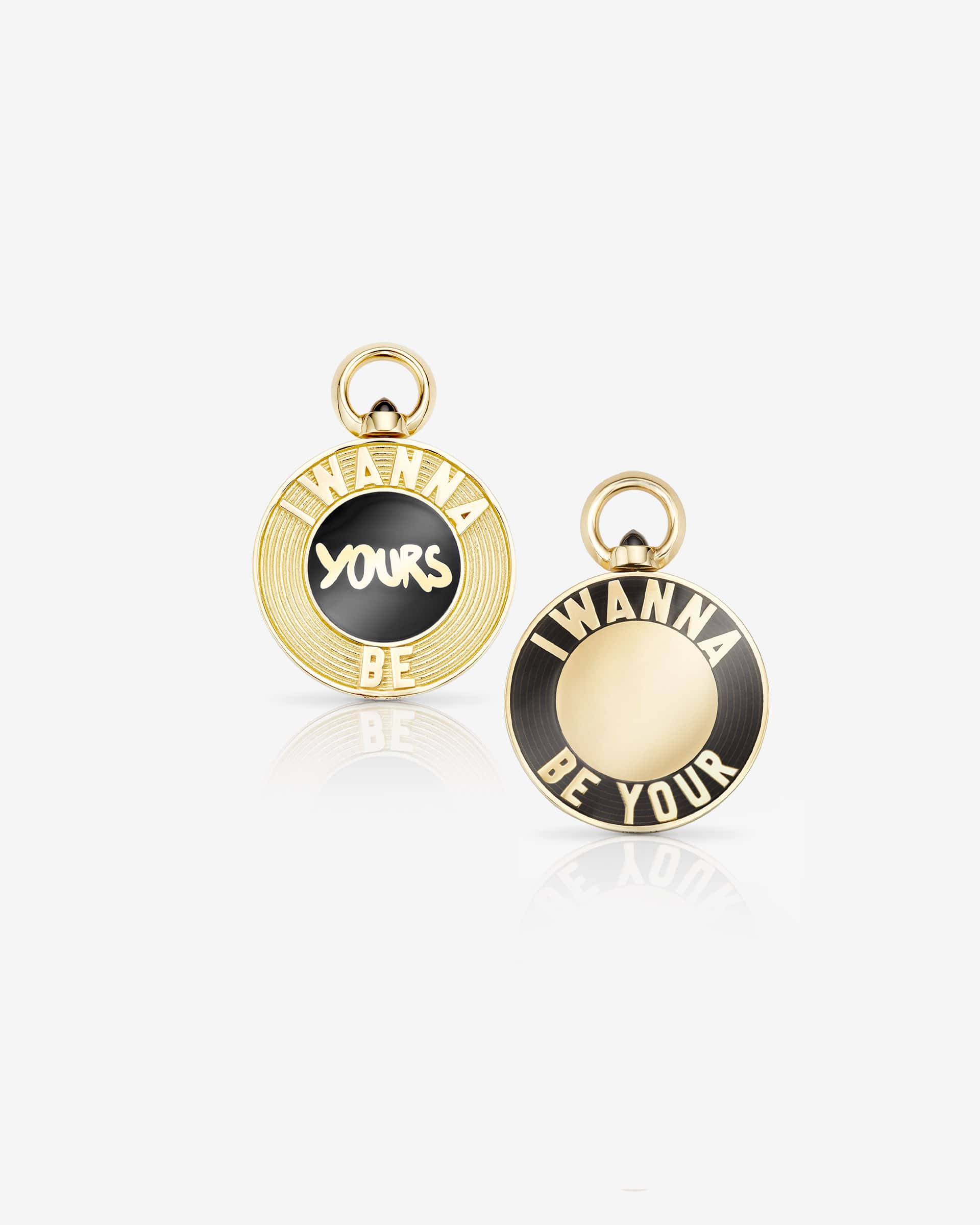 Stephen Webster I Wanna Be Yours Black Enamel personalised pendant — 18 ct yellow gold flip-pendant with opaque black enamel centre reading “I Wanna Be Yours”, front view