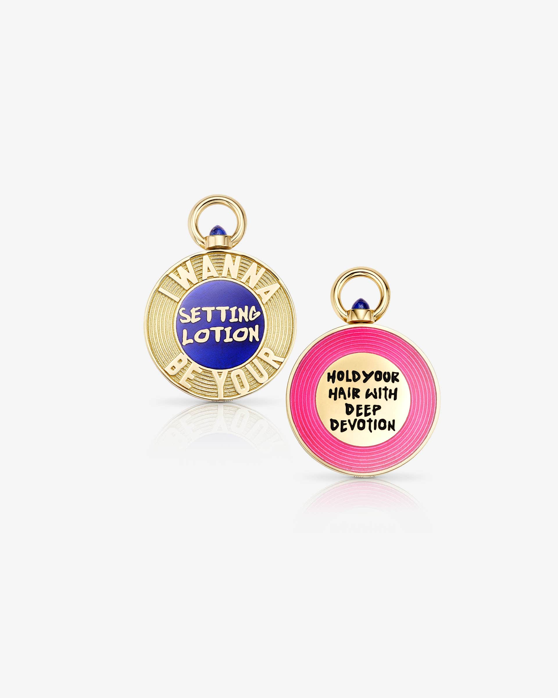 Stephen Webster I Wanna Be Your Setting Lotion pendant — 18 ct yellow gold flip-pendant with lapis blue enamel centre reading “I Wanna Be Your Setting Lotion”, front view