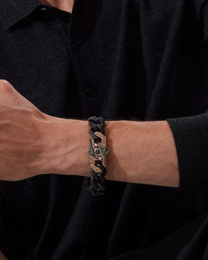 Model wearing Stephen Webster Wrist Full of Dollars clasp in rose gold & sterling silver with central grey spinel and mother of pearl back plate
