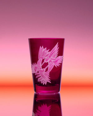 Stephen Webster x Artěl Flight Encounter Purple Crystal Tumbler on Artistic Background Highlighting Handcrafted Crystal & Gold Detail