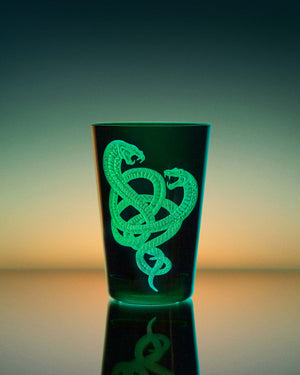 Stephen Webster x Artěl Master Serpent in Racer Green Crystal Tumbler on Artistic Background Highlighting Handcrafted Crystal & Gold Detail