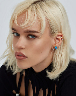 Black opalescent Crystal Haze slimline cuff earrings worn on the ear in 18ct white gold