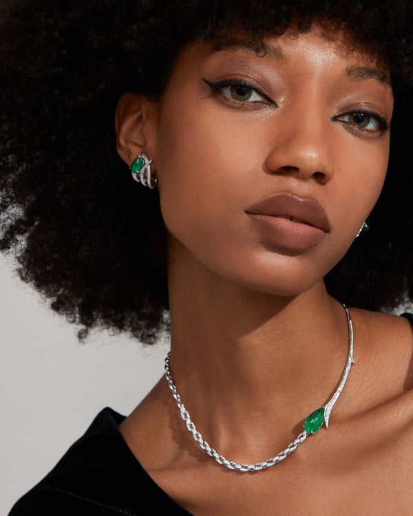 Caged Emerald Earrings styled with other luxury fine jewellery, contemporary layered look