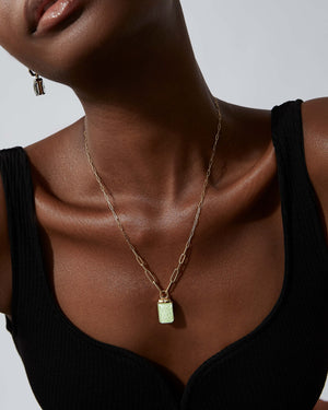 Chrysolemon Obsidian Crystal Haze and diamond twister pendant worn on the neck in 18ct yellow gold