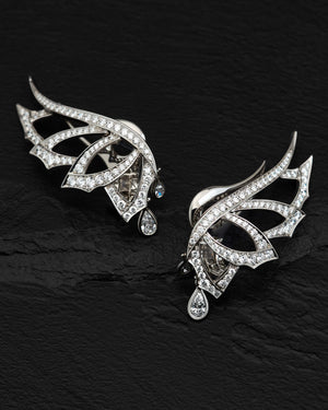 Close-up of white diamond pavé and intricate plume feather design on Open Plume Ear Cuffs