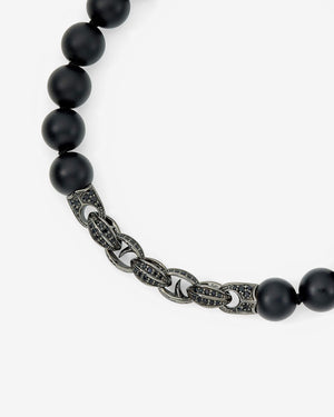 Close-up of the black sapphire pavé and matt black onyx beads with Thorn motif on Stephen Webster Thorn Beaded Bracelet