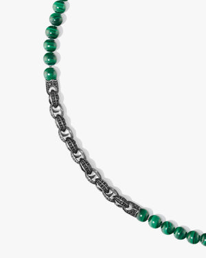 Close-up detail of green malachite gemstone beads and black sapphire pavé Thorn motif on Stephen Webster Thorn Beaded Necklace