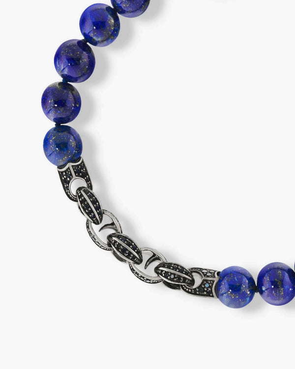 Close-up of blue lapis beads, black sapphire pavé and polished sterling silver Thorn motif on the Stephen Webster bracelet