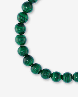 Close-up detail of the green malachite gemstone beads and polished sterling silver Thorn clasp on Stephen Webster Thorn Malachite Beaded Bracelet