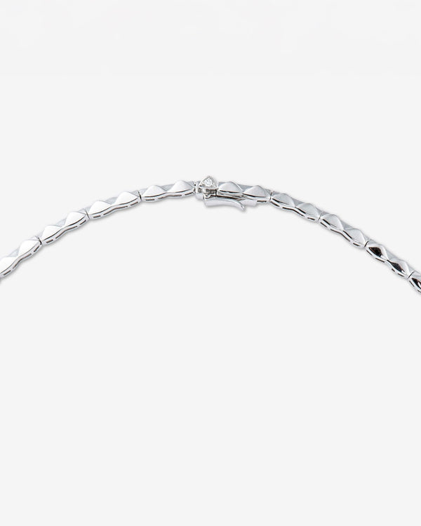 Close-up of white diamond pavé and feather-inspired detailing on White Gold Tail Feather Collar