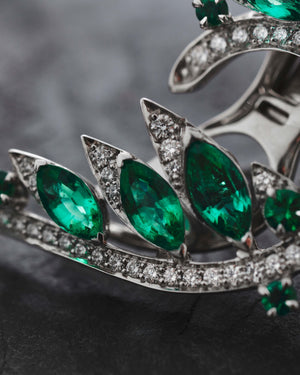 Close-up of marquise emeralds and white diamond pavé detailing on White Gold Plumage Earrings