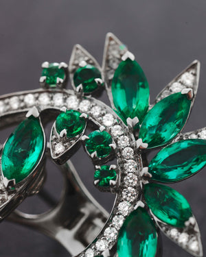 Close-up of marquise emeralds and white diamond pavé detailing on White Gold Plumage Earrings