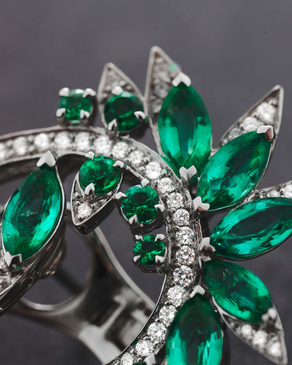 Close-up of marquise emeralds and white diamond pavé detailing on White Gold Plumage Earrings