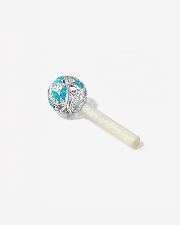 'Cry By Night' Rattle' in sterling silver turquoise enamel butterfly design, thorn-inspired openwork and mother-of-pearl handle - side view