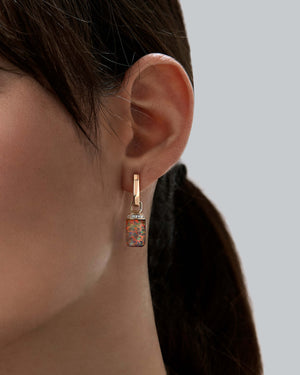 Crystal Haze and diamonds small twister earrings worn on the ear in 18ct yellow gold