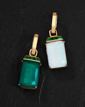Close-up of Crystal Haze gemstones and emerald details on 18ct yellow gold small twister earrings