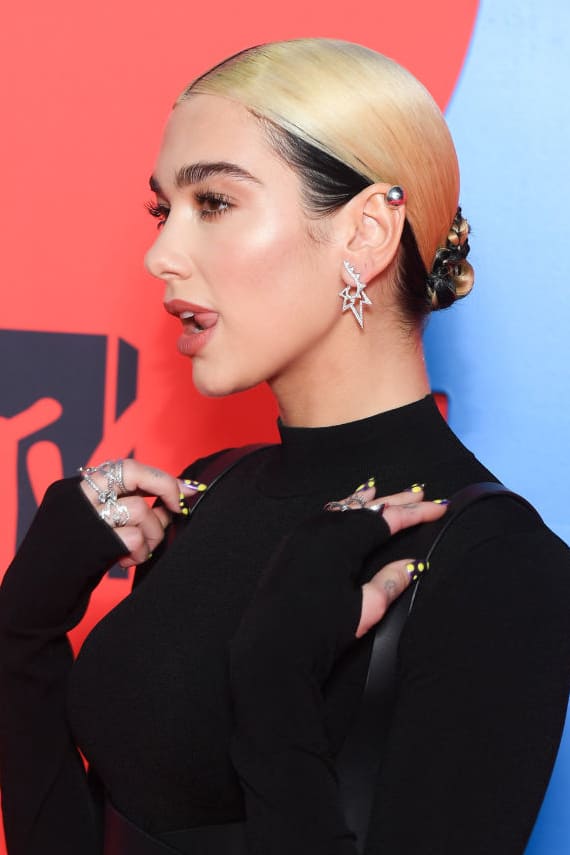 Dua Lipa wearing Stephen Webster Lightning Bolt Band Ring and Lightning Bolt Hoop Earrings