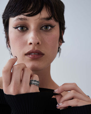 Eternal Plume Band Ring worn on finger showcasing 18ct white gold and diamond pavé