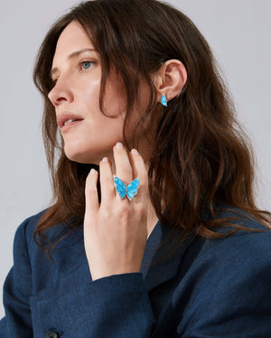 Fly By Night butterfly Crystal Haze cocktail ring styled with other butterfly jewellery in 18k white gold