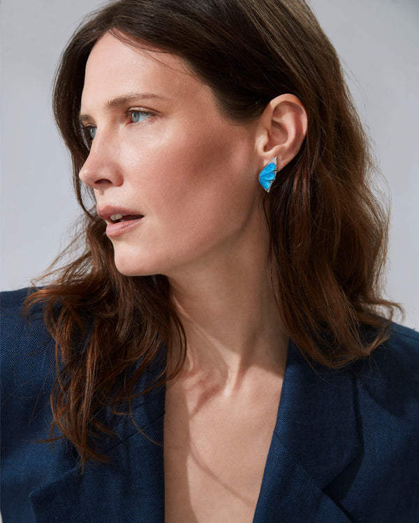 Model wearing Fly By Night butterfly cuff earrings in 18k white gold with gemstones