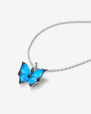 Side view of Fly By Night mini butterfly Black Opalescent Crystal Haze pendant necklace in 18k white gold
