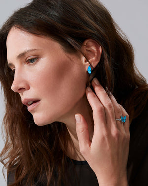 Model wearing Fly By Night mini butterfly Crystal Haze cocktail ring in 18k white gold