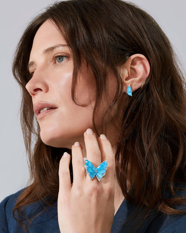 Model wearing Fly By Night mini butterfly cuff earrings in 18k white gold with gemstones