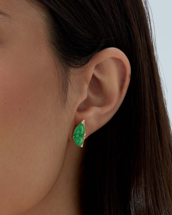 Close up of model wearing Fly By Night butterfly earrings in 18k yellow gold with precious green gemstones