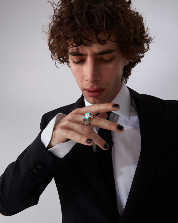 Male model wearing Stephen Webster × Machine Gun Kelly Gossip Ring — silver ring with turquoise enamel star