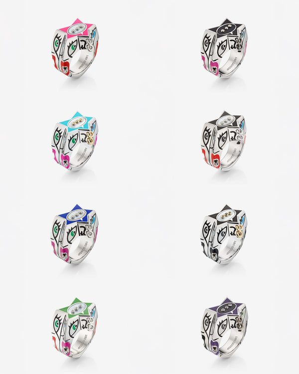 Flat-lay view of Stephen Webster × Machine Gun Kelly Gossip Set of 8 Rings on neutral background — eight enamel-star silver rings