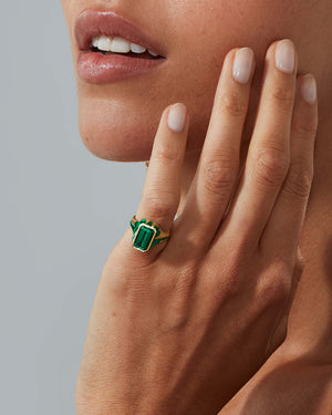 Model wearing a Green Tourmaline signet ring in 18ct Yellow Gold by Stephen Webster