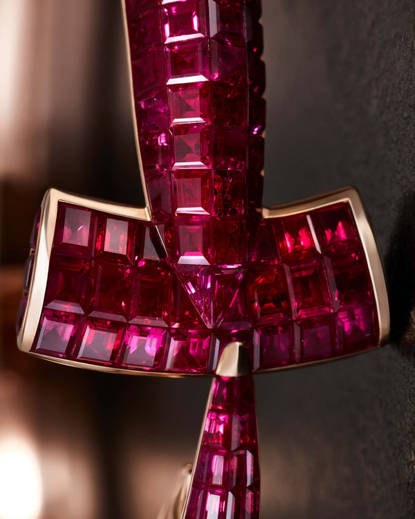 Close-up of square cut rubies on Stephen Webster Hammerhead Bangle in 18ct rose gold, high-end gemstone detail