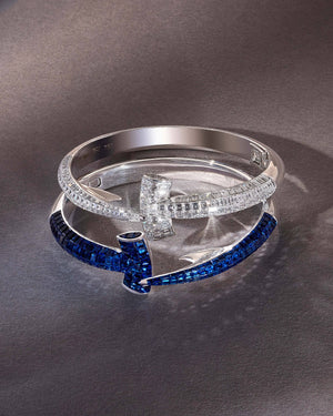 Close-up of white diamond detail on Stephen Webster Hammerhead Bangle in 18ct white gold, premium gemstone luxury jewellery