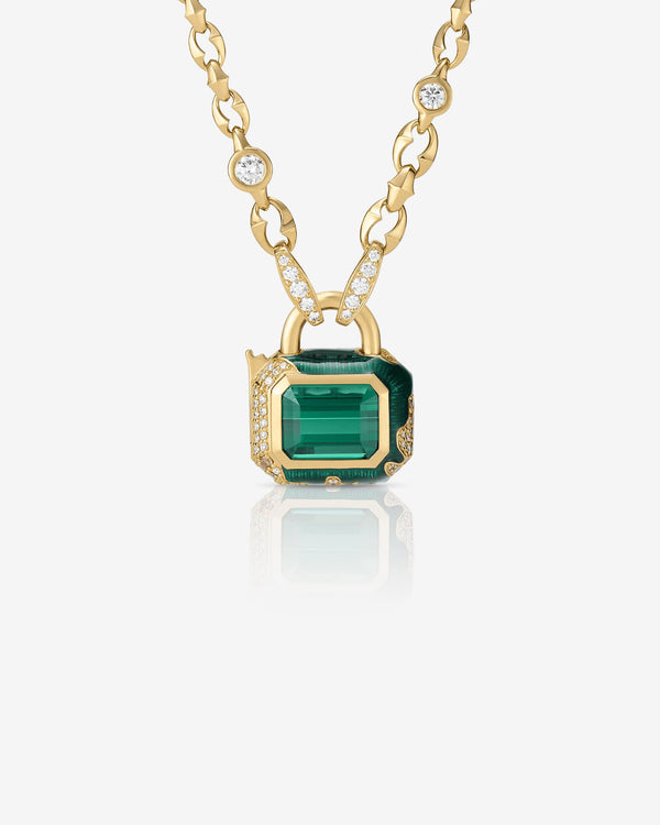 Full Bleed Interlock Pendant in 18 ct yellow gold with green tourmaline centre and graduated brown & white diamonds — close up