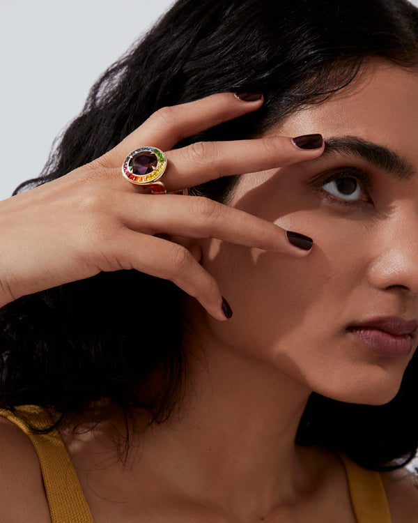 Model wearing Joie De Vivre ReBelles ring — yellow-gold cocktail ring with lilac spinel and rainbow gemstones