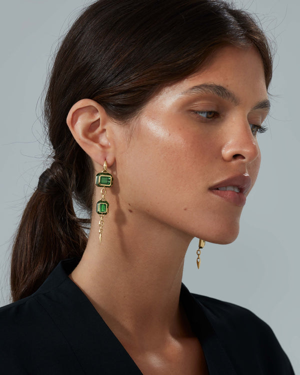 Model wearing long Green Tourmaline drop earrings in 18ct Yellow Gold by Stephen Webster