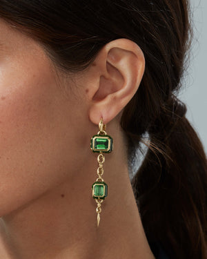 Model wearing long Green Tourmaline drop earrings in 18ct Yellow Gold by Stephen Webster