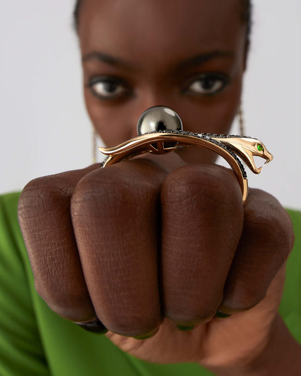 Side profile of Love On The Nile ring showing yellow-gold band and double-finger snake shank design