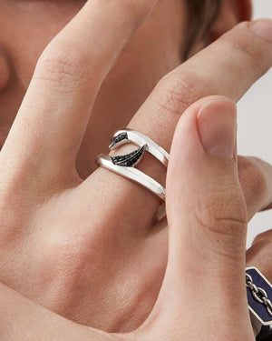 Macro close-up of Stephen Webster Double Black Sapphire Thorn Band on model’s hand showing black sapphire detail and polished finish