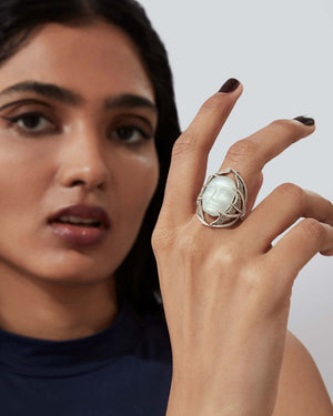 Model wearing Making Waves ReBelles ring — 18 ct white-gold cocktail ring with moonstone and diamonds