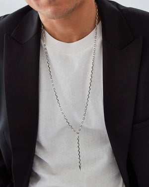 Male model wearing Stephen Webster Classic Thorn silver lariat necklace — luxury men’s jewellery styling
