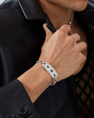 Male model wearing Stephen Webster Inline Razer Bracelet in sterling silver — luxury men’s jewellery styling