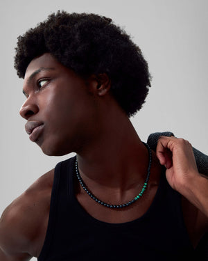 Male model wearing Stephen Webster Thorn Beaded Malachite Necklace — luxury men’s jewellery styling