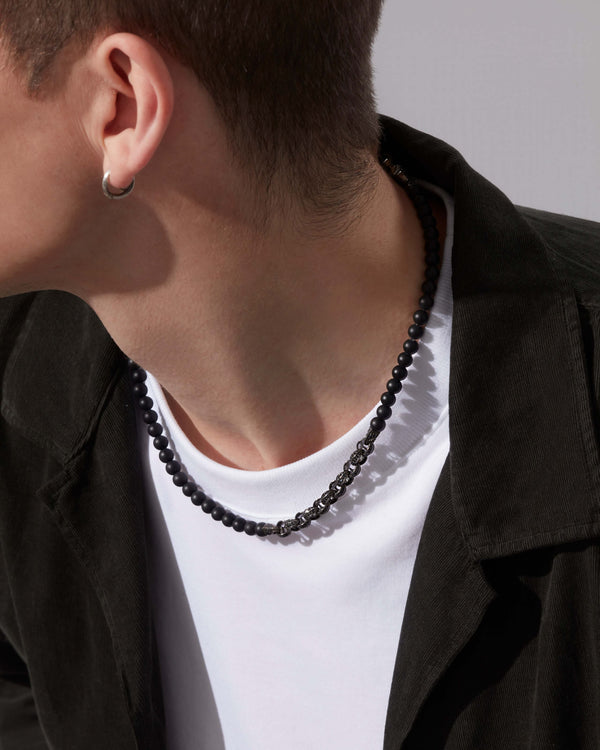 Male model wearing Stephen Webster Thorn Black Sapphire Beaded Necklace — men’s luxury jewellery styling