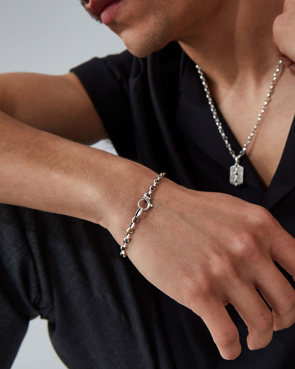 Male model wearing Stephen Webster Thorn Classic 7 mm link bracelet in sterling silver — luxury men’s jewellery