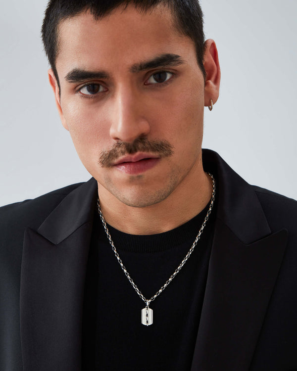 Male model wearing Stephen Webster Thorn Medium Razer Tag necklace — luxury men’s jewellery styling