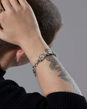 Male model wearing Stephen Webster Thorn S Link Bracelet — luxury men’s jewellery styling