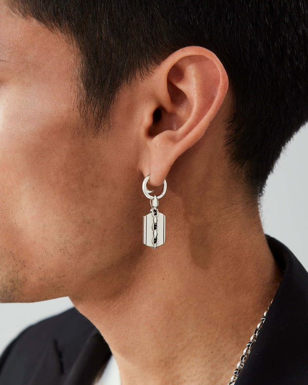 Male model wearing Stephen Webster Thorn Sleeper earring in sterling silver — men’s luxury jewellery styling