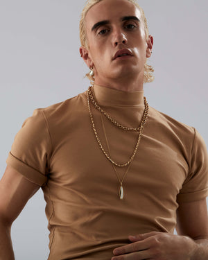 Men’s necklace featuring Stephen Webster yellow gold Switchblade pendant with white mother-of-pearl inlay — luxury fine jewellery