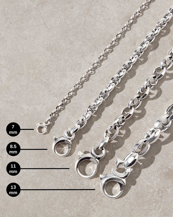 Close-up detail of the thorn-inspired polished sterling silver Stephen Webster bracelets, showcasing difference in sizes.